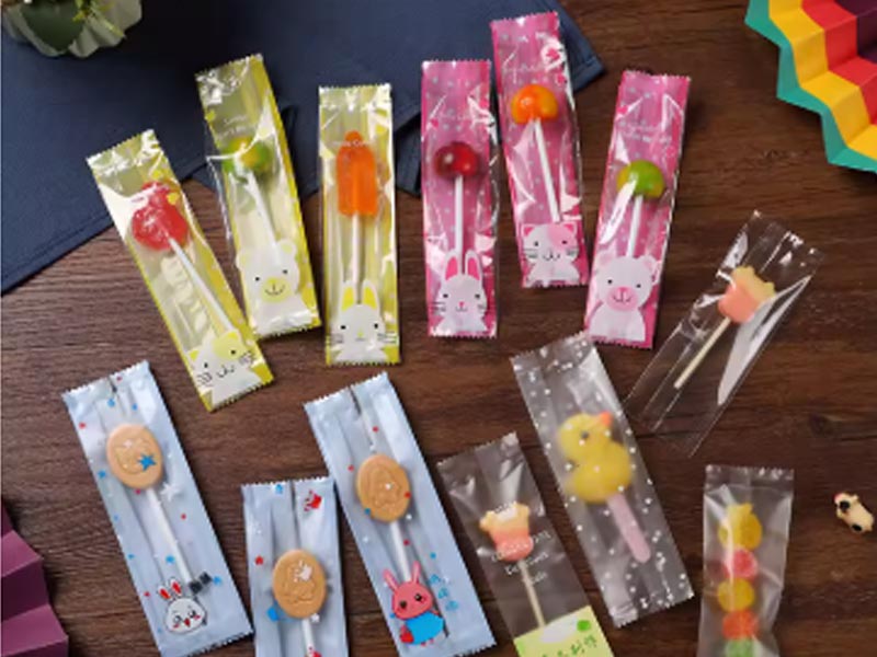 Automatic candy wrapping machine for individual hard candy packaging